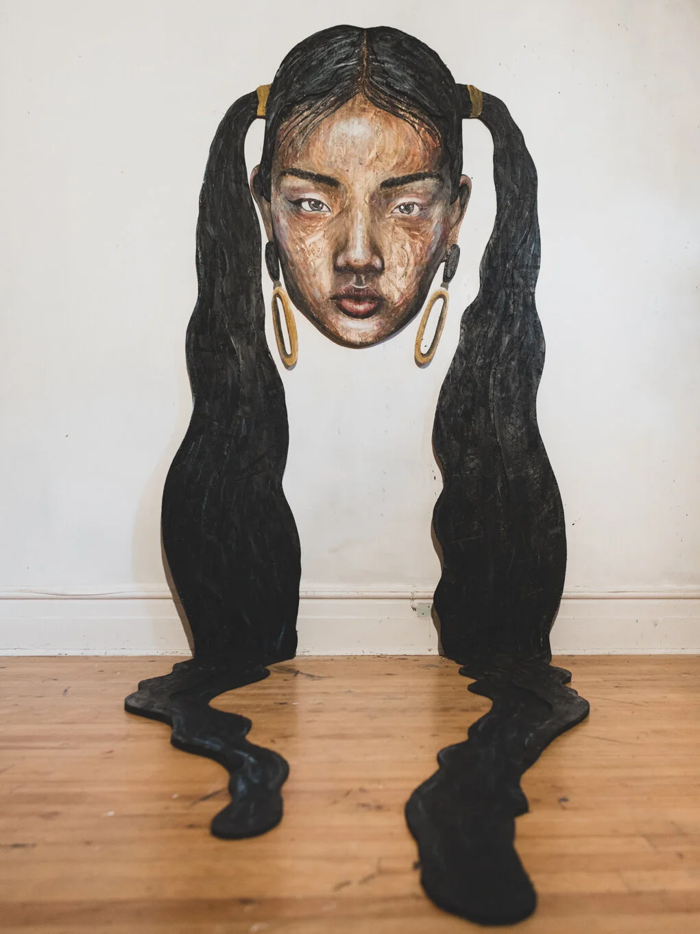 Textured mixed media portrait featuring non-conventional painting techniques Quebec artist