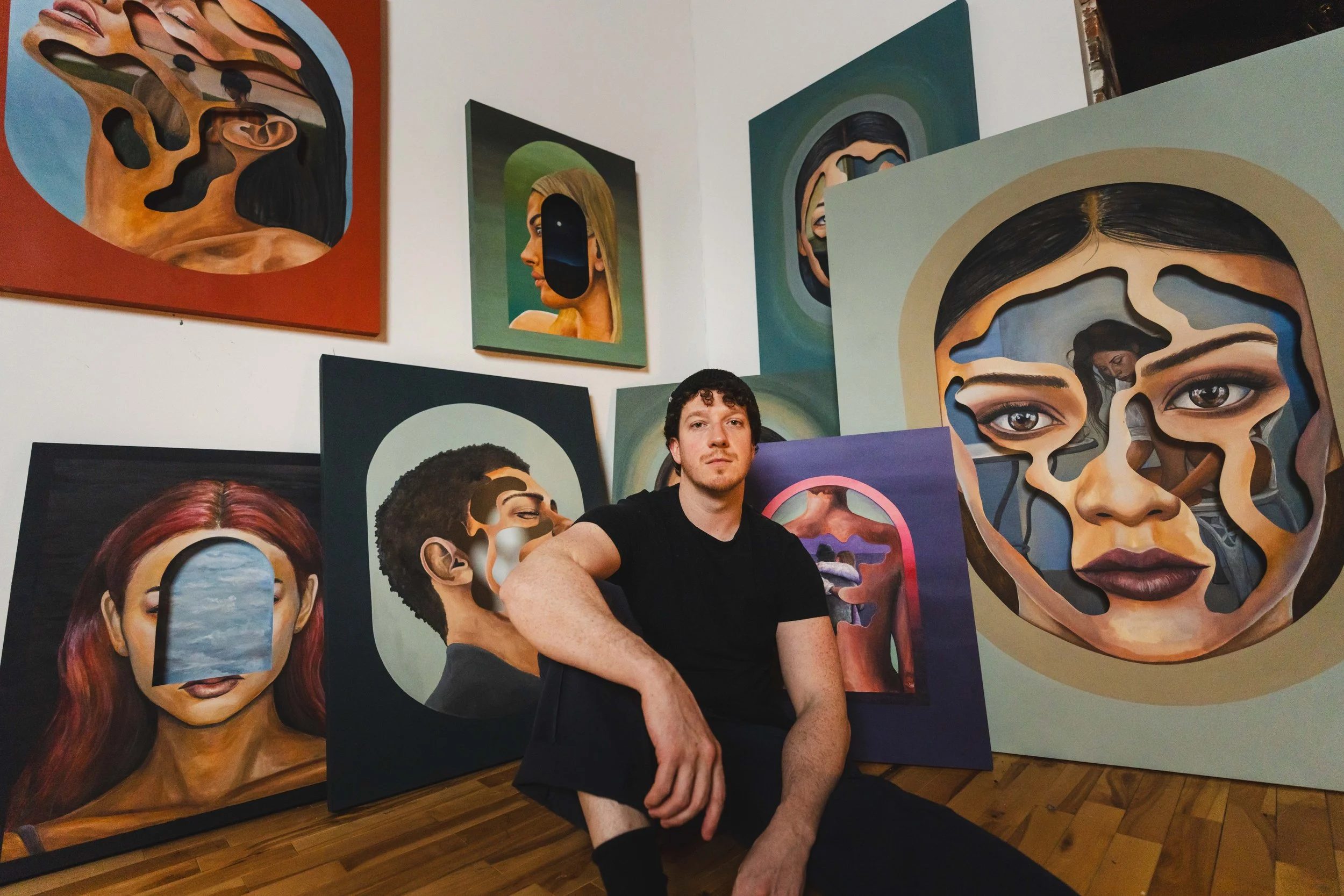 Nick Bodoin, contemporary portrait artist in his Montreal studio working with mixed media and traditional craftsmanship